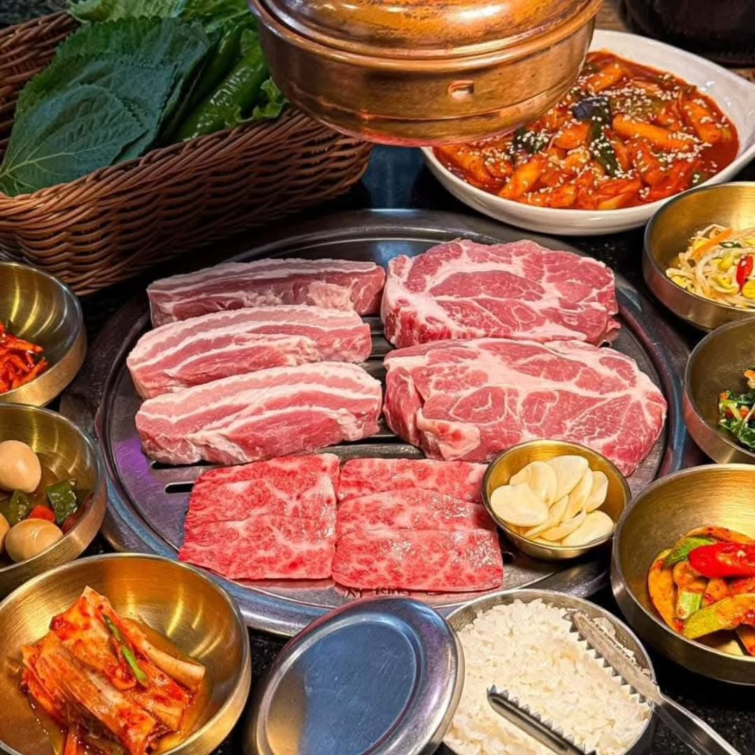 Experience a whirlwind of authentic flavors at our Korean BBQ restaurant, where every bite promises an adventure 😋 Our signature dish, the mouthwatering Samgyeopsal, is perfect for those who crave the rich taste of grilled pork belly, expertly seasoned with unique spices 🌶️. Compliments of the house, indulge in endless servings of fresh kimchi, offering a tangy and spicy kick to every meal 🌿 Complimentary sides enhance your experience, from the nutty undertone of sesame leaves 🥬 to zesty bites of papaya salad, each highlighting Korea's vibrant culinary landscape 🍽️ 

Every ingredient, from the fresh vegetables to the premium meats, is carefully selected to ensure the perfect balance of taste and nutrition. Burst with every bite as our secret sauces and spices work together to elevate your dining experience 🍲 Join us for an unforgettable meal where the unique flavors of Korean cuisine come to life in each meticulously crafted dish! 🥢

우리 한식 바비큐 레스토랑에서 진정한 풍미의 소용돌이를 경험해보세요. 한 입 한 입이 새로운 모험을 약속합니다 😋 저희 시그니처 메뉴인 군침 도는 삼겹살은 독특한 향신료로 정성스럽게 양념한 돼지고기구이의 진한 맛을 원하는 분께 완벽한 선택입니다 🌶️. 저희가 준비한 서비스로, 신선한 김치를 무한으로 즐길 수 있으며, 매콤하고 새콤한 맛이 모든 식사에 활력을 불어넣습니다 🌿. 참깨잎의 고소한 향미 🥬에서 파파야 샐러드의 상큼한 한 입까지, 무료로 제공되는 반찬들이 대한민국의 다채로운 미식 세계를 강조합니다 🍽️

신선한 채소부터 고급 육류까지, 모든 재료는 맛과 영양의 완벽한 균형을 위해 꼼꼼하게 선별됩니다. 한 입 한 입 터지는 맛의 향연, 저희만의 비밀 소스와 향신료가 조화를 이뤄 식경험을 한차원 끌어올립니다 🍲. 한국 요리만의 독특한 풍미가 하나하나 정성스럽게 만들어진 요리에서 살아 숨 쉬는 잊지 못할 식사를 저희와 함께 하세요! 🥢

#KoreanBBQ
#TasteOfKorea
#SpicyDelights
#KoreanFoodLove
#BBQTime
#KimchiLovers
#Samgyeopsal
#TasteAdventure
#HealthyEating
#FoodieHeaven