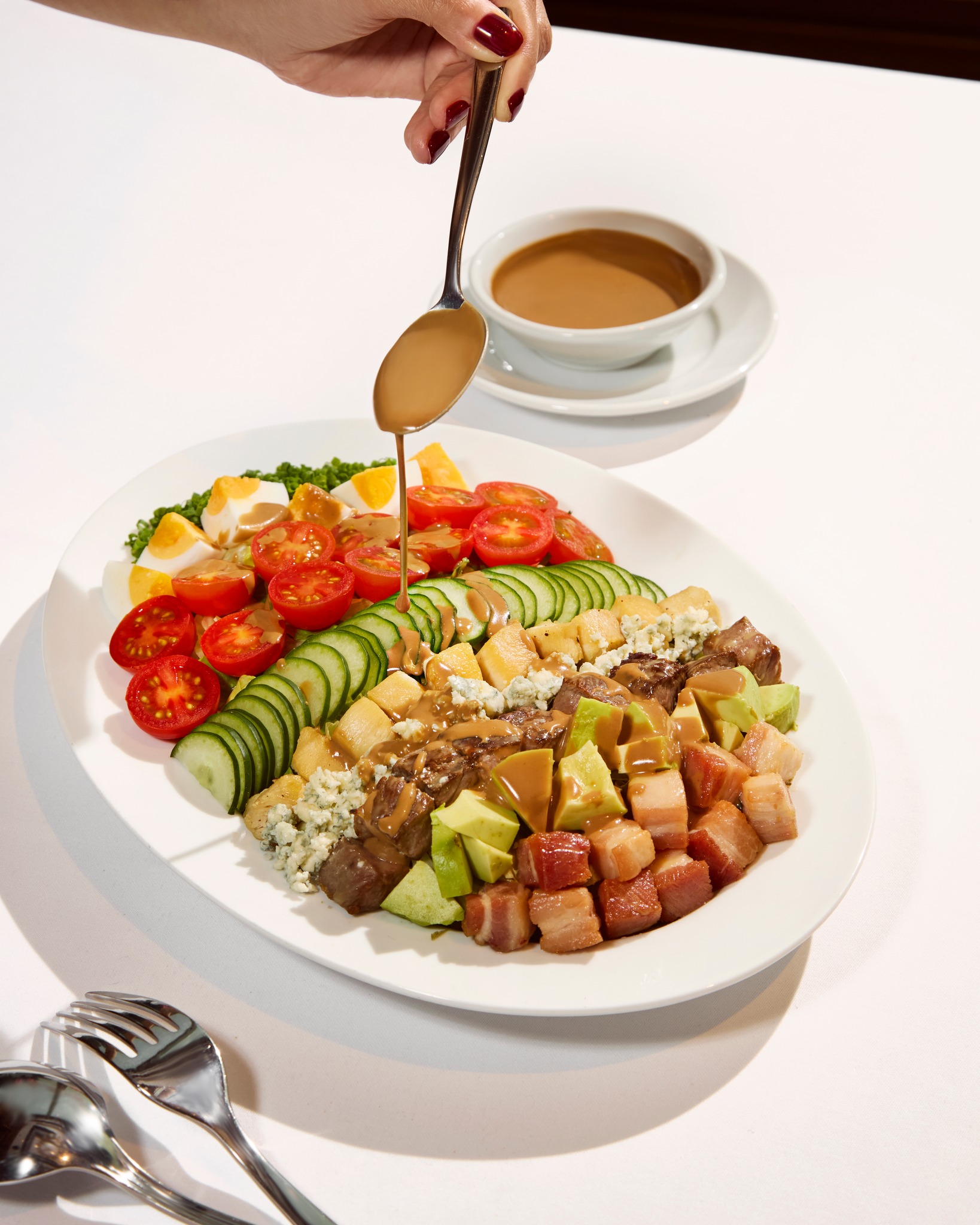 A Fresh Side of Wolfgang’s.
​
While we are the kings of steak, our commitment to freshness extends to the garden.
​
Meet the Wolfgang’s Cobb Salad— a New York classic designed for the busy executive, available for Lunch only.
​
Meticulously prepared with our USDA Prime dry-aged beef, bacon, grilled chicken, avocado, and blue cheese, it’s the high-protein, light-yet-filling choice for your next working lunch at The Storeys.
​
Balance your meal with the finest greens in the city.
​
━━━━━
For Reservation:
064-567-2929
LINE ID: wg.reservation
reservation@wolfgangssteakhouse.th
━━━━━
Wolfgang's Steakhouse Bangkok
3rd Floor, The Storeys at One Bangkok
Hours:
Monday - Sunday from 11:30 AM – 11:30 PM (Last order 10:30 PM)
Lunch: 11:30 AM – 3:30 PM (Last order 3:00 PM)
​
#WolfgangsSteakhouseThailand #OneBangkok #BangkokDining #USDAPrime