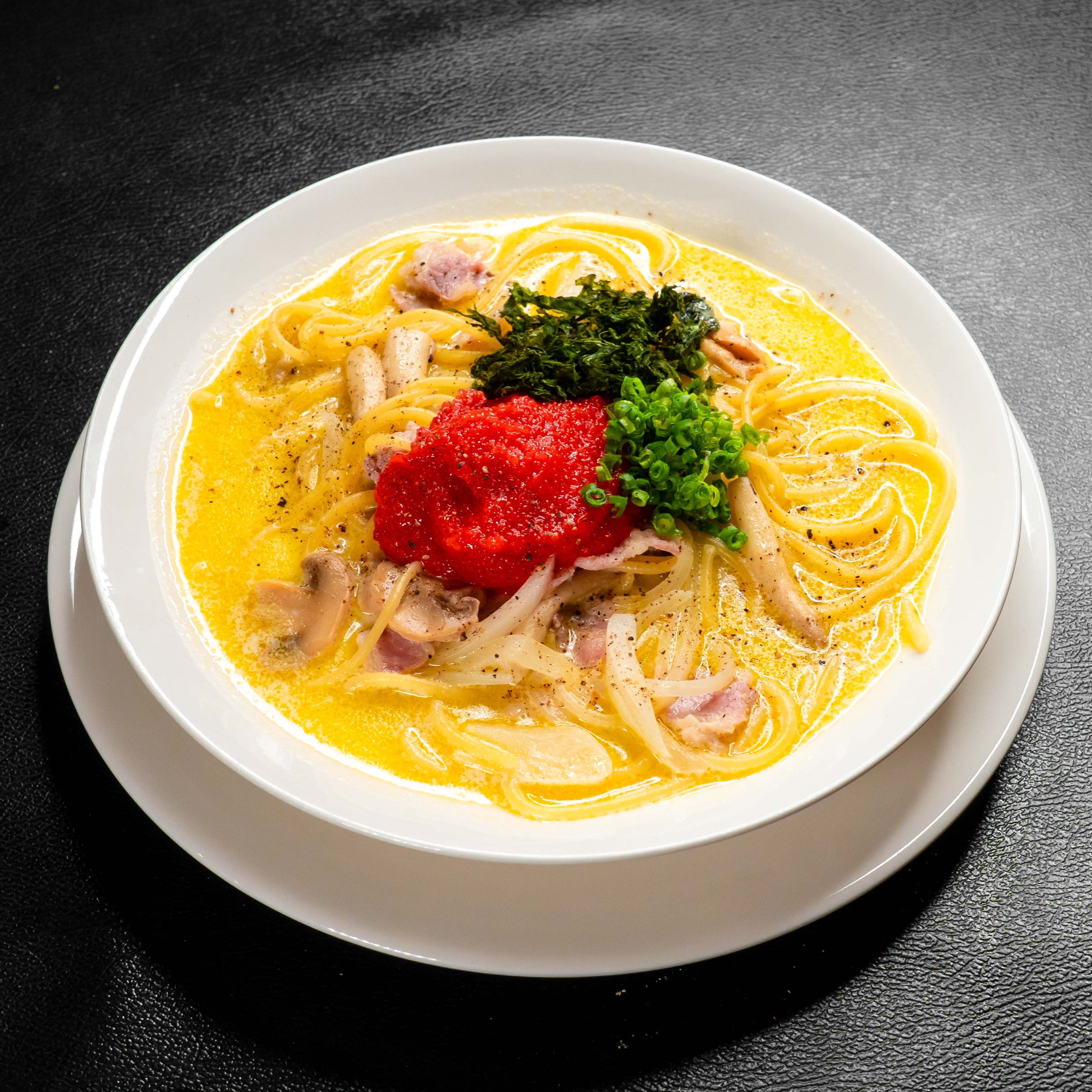 Have you tried our Mentaiko Cream Soup Pasta? 🍝

RUMBA人気のスープパスタメニュー
まろやかで軽めのクリームスープに、たっぷり明太子

最初はクリームスープをそのまま
途中から明太子を少しずつ溶かしていくと、
コクと塩気が加わって味が変わっていきます😋

「明太子は飲みもの。」
そんな感覚で、最後のスープまでぜひ♪( ´θ｀)ノ

麺少なめ／普通 350B
麺大盛り 380B

最後はバゲット（+20B）で
残ったスープまでどうぞ🥖

📍Thonglor RUMBA
🕚 11:30–23:00

#ThonglorRUMBA #スープパスタ #明太子クリーム #BangkokFood #ThonglorFood